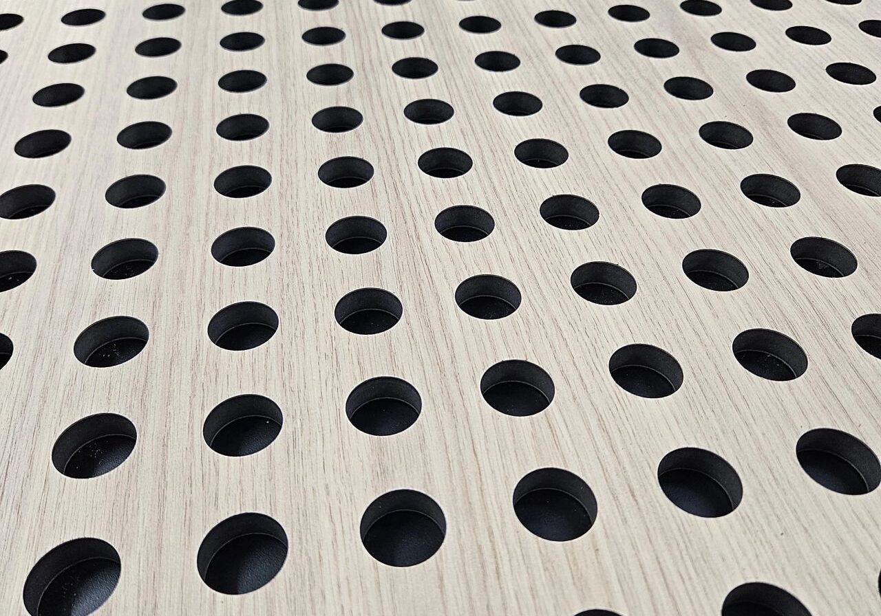 Oak veneered MDF perforated panel for commercial interior fitout contractor